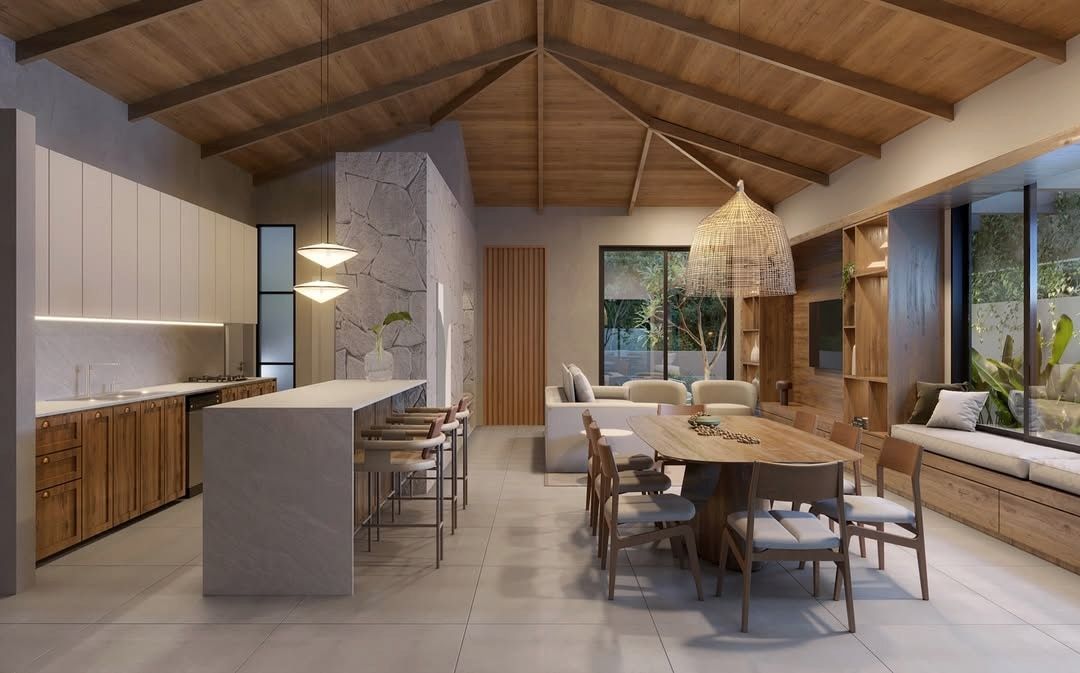Estudo tridimensional da Casa JV: cozinha gourmet integrada com ilha e mesa de jantar.