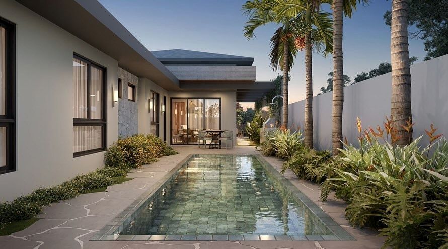Estudo tridimensional da Casa JV: area de lazer ao entardecer com piscina alongada em pastilha verde e coqueiros.